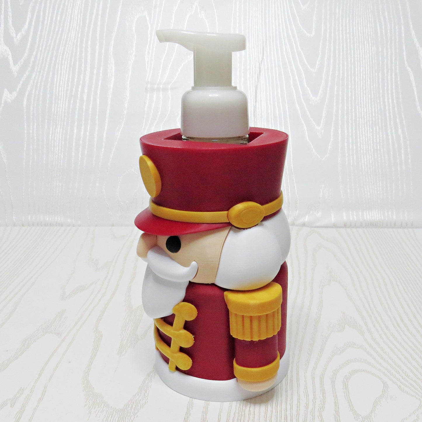 Nutcracker Foaming Soap Holder - Christmas Sink Decor - lifestyle with soap bottle inserted