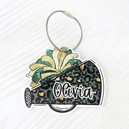 Personalized cheerleader bag tag with glitter megaphone and pom-pom design, custom name gift from Kenzie’s Boutique.