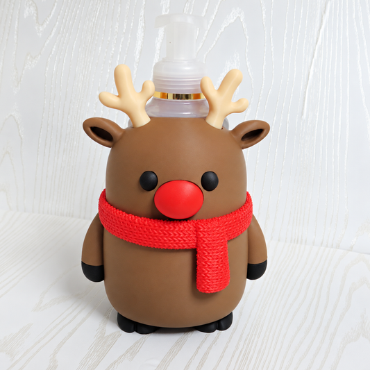 Brown reindeer shaped foaming soap bottle holder with red nose and red scarf for Christmas decor