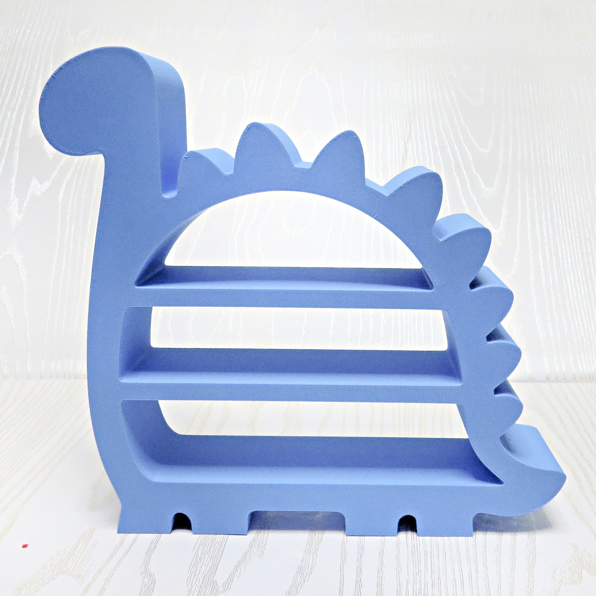 periwinkle-blue-3d-printed-brontosaurus-dinosaur-three-tier-open-shelf-spiked-ridge-curled-tail-kids-room-decor