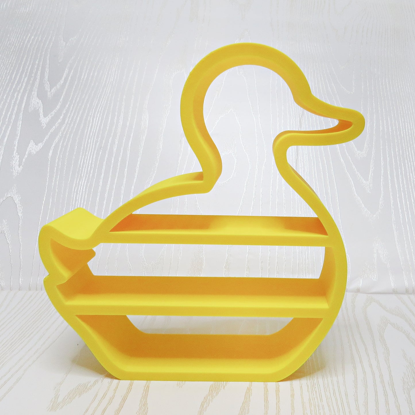 yellow-3d-printed-rubber-duck-silhouette-three-tier-open-shelf-looped-neck-bill-wing-kids-nursery-bathroom-decor