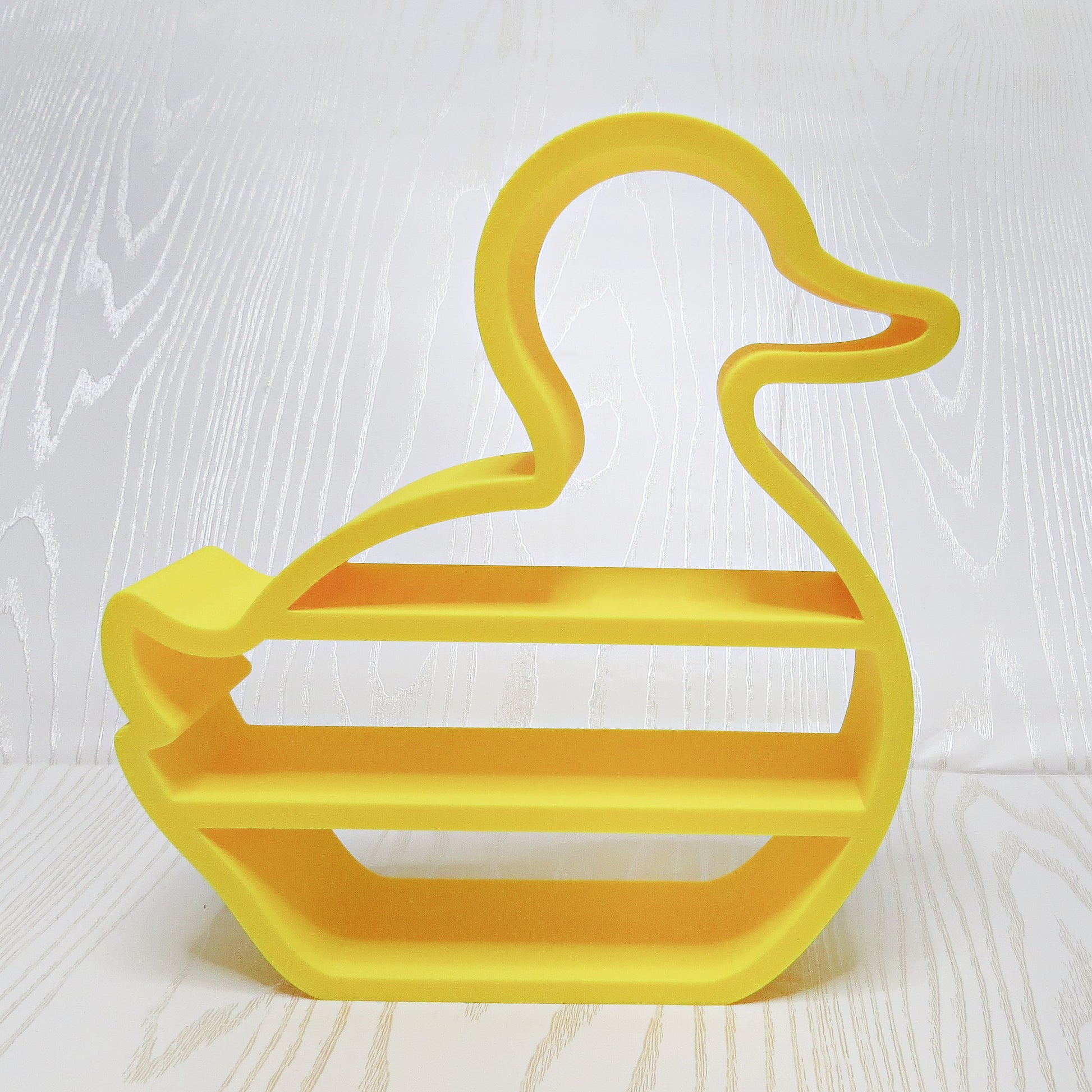 yellow-3d-printed-rubber-duck-silhouette-three-tier-open-shelf-looped-neck-bill-wing-kids-nursery-bathroom-decor