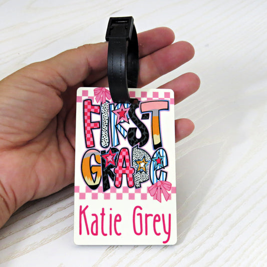 personalized-first-grade-bag-tag-with-name-school-supplies-crayons-notebook-pink-backpack