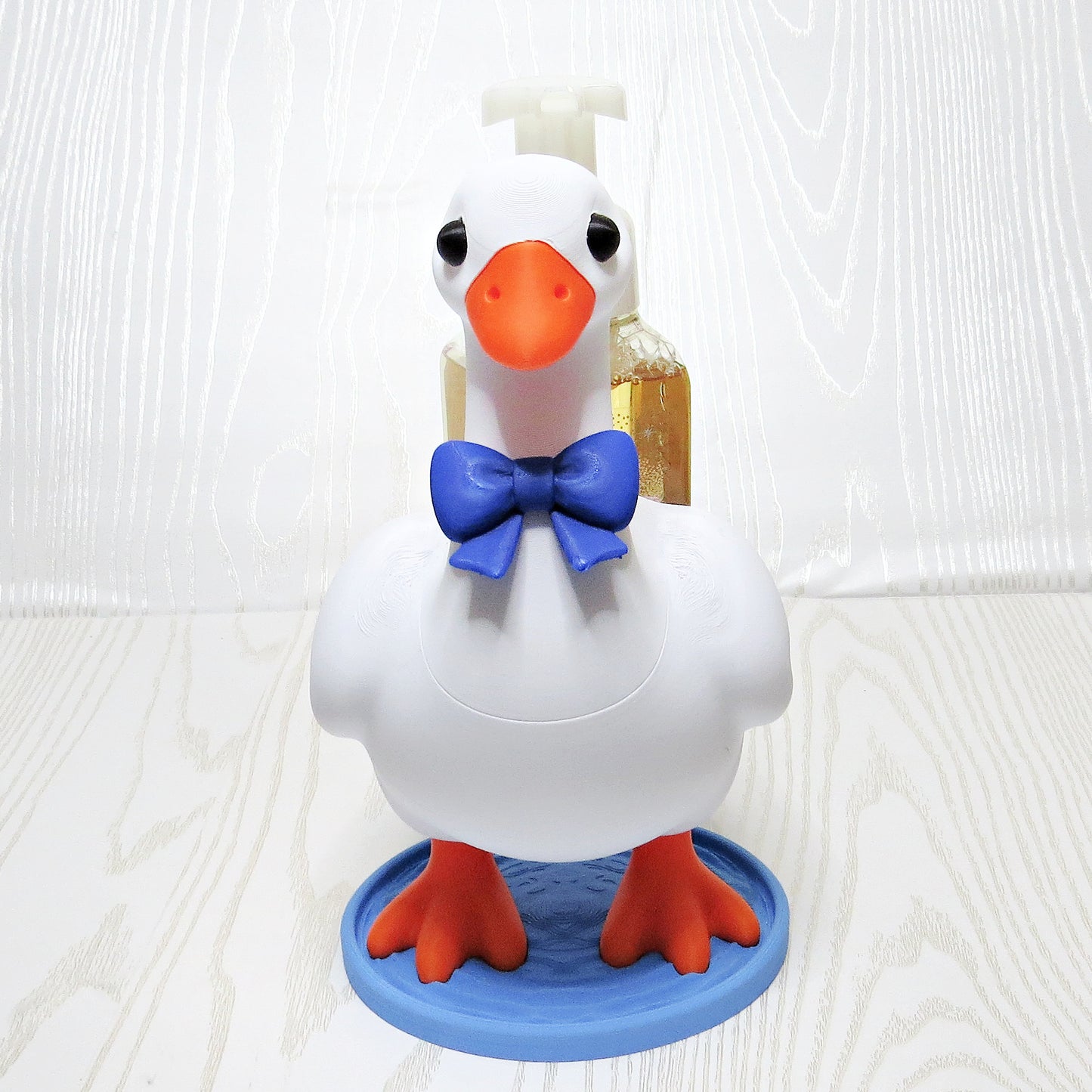 white-3d-printed-goose-foaming-soap-bottle-holder-blue-bow-tie-orange-feet-water-base-bathroom-decor