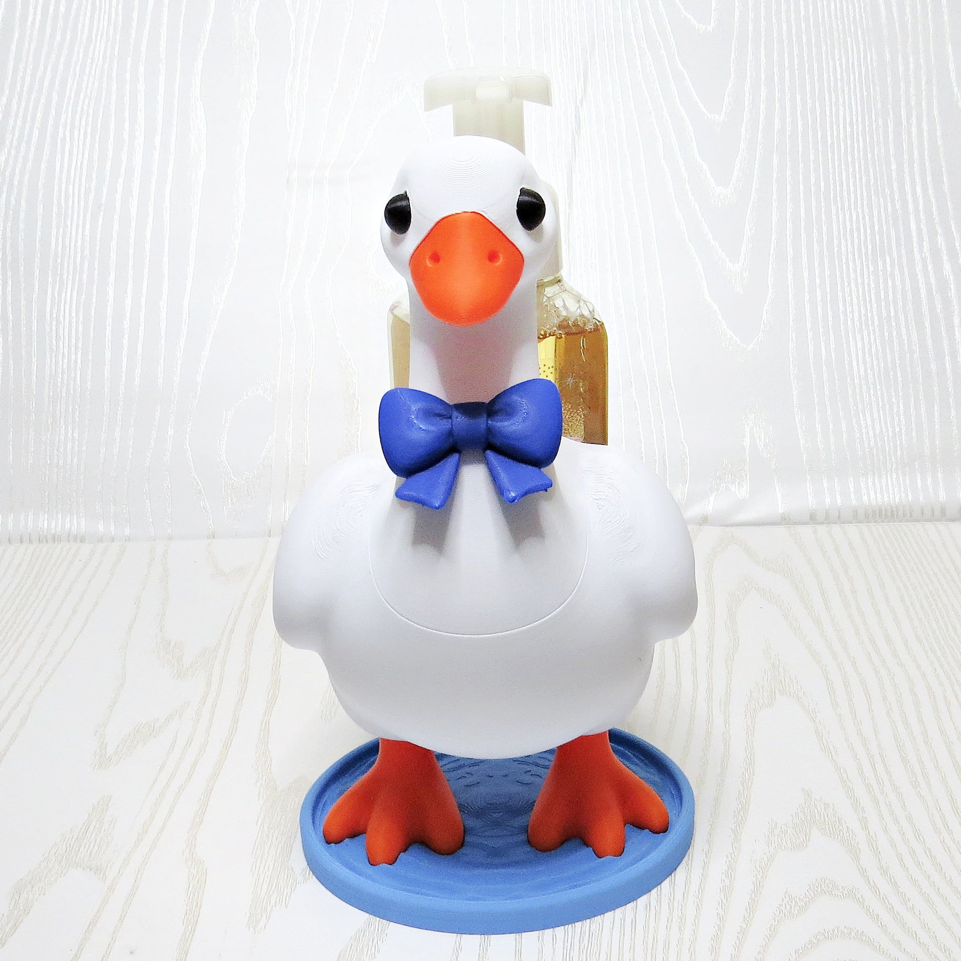 white-3d-printed-goose-foaming-soap-bottle-holder-blue-bow-tie-orange-feet-water-base-bathroom-decor