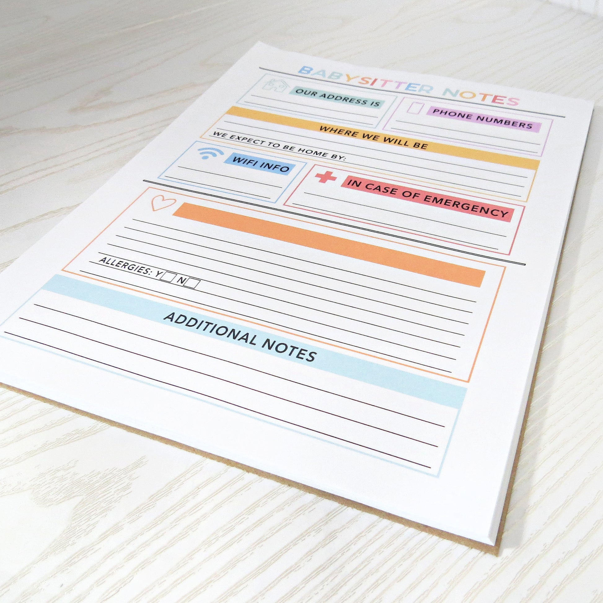 Babysitter Notes Notepad - Organized Parent & Sitter Info Sheet - spine and cover angle shot