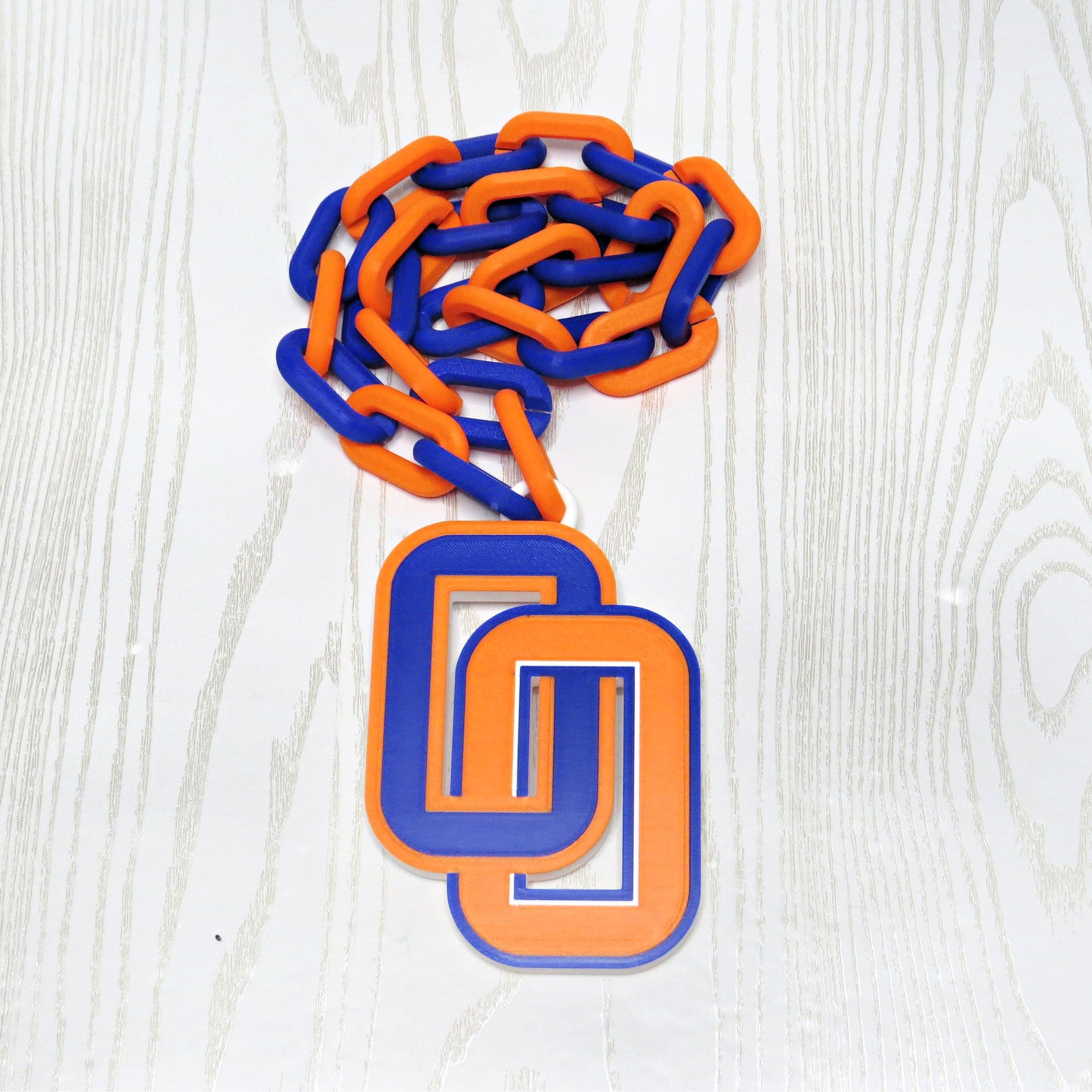 Blue and orange school spirit hype chain necklace laid flat
