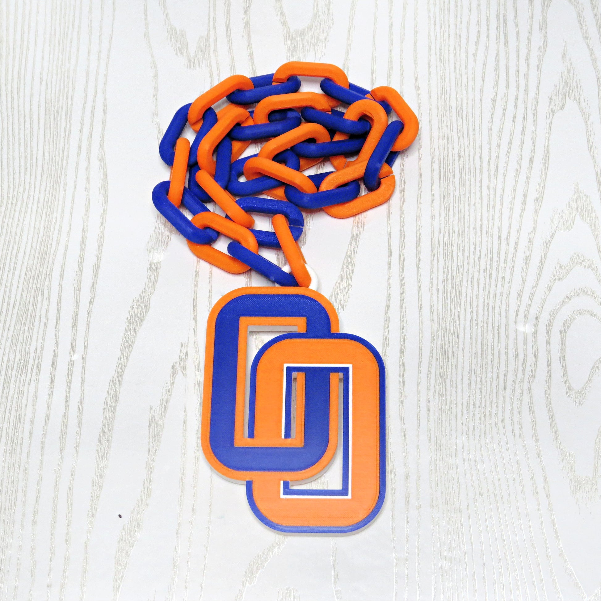 Blue and orange school spirit hype chain necklace laid flat