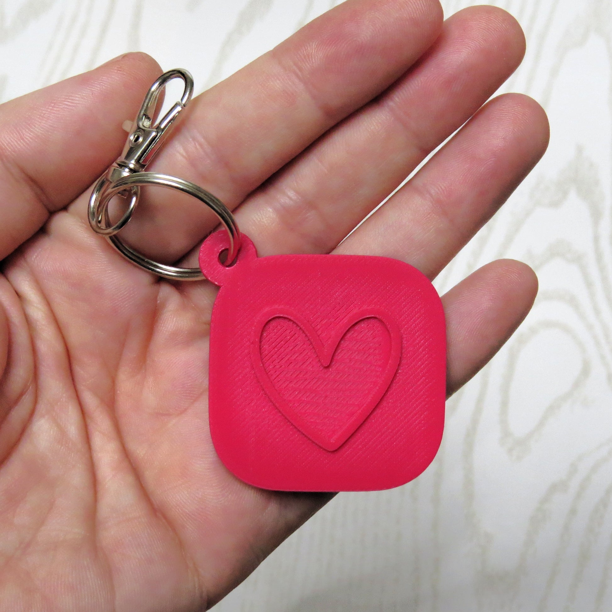 Heart NFC Keychain Tag - Smart Tap Digital Sharing Keychain - flat lay showing multiple pieces