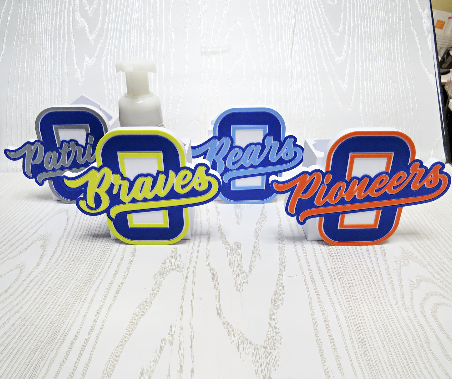 Personalized Olentangy High School BBW foaming soap holder featuring Braves, Bears, Patriots, and Pioneers school spirit designs