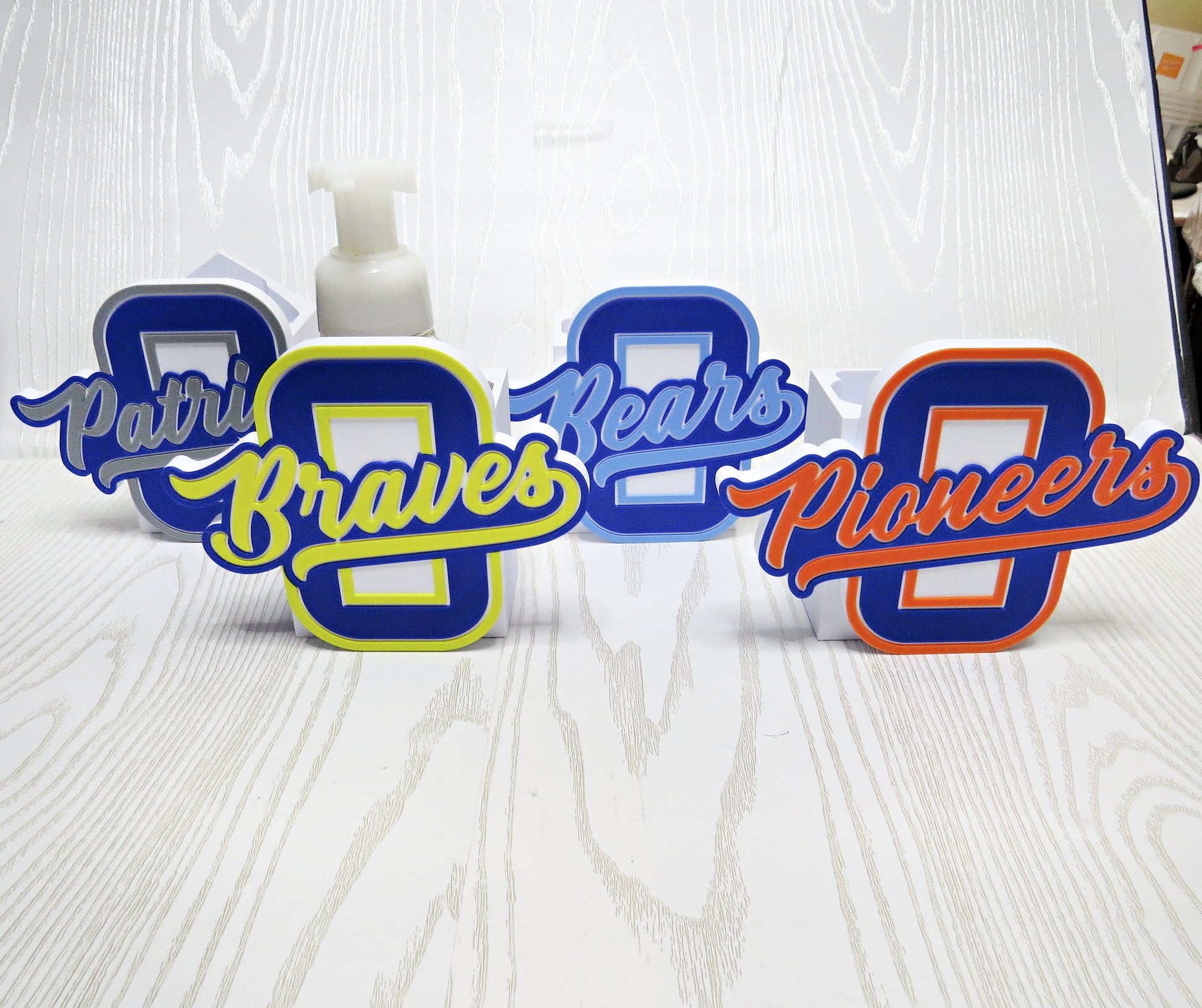 Personalized Olentangy High School BBW foaming soap holder featuring Braves, Bears, Patriots, and Pioneers school spirit designs