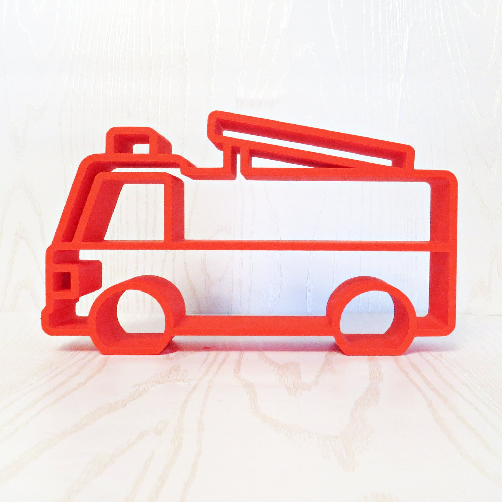 red-3d-printed-fire-truck-silhouette-open-frame-shelf-cab-ladder-arm-wheel-cutouts-kids-room-playroom-decor