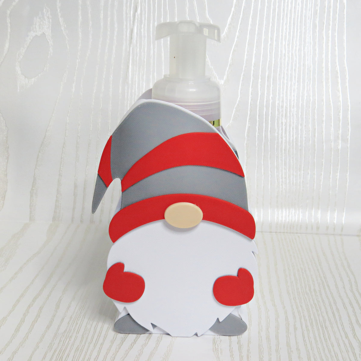 Red gray and white Christmas gnome shaped foaming soap bottle holder for holiday decor
