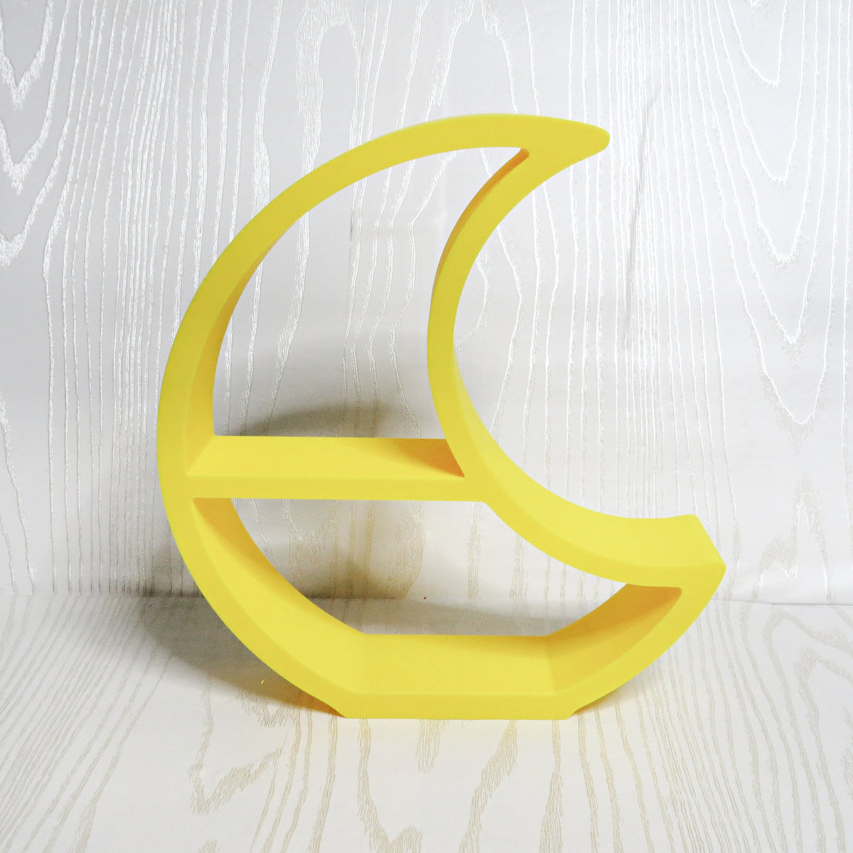 Yellow crescent moon shaped freestanding two tier display shelf for crystals and small keepsakes