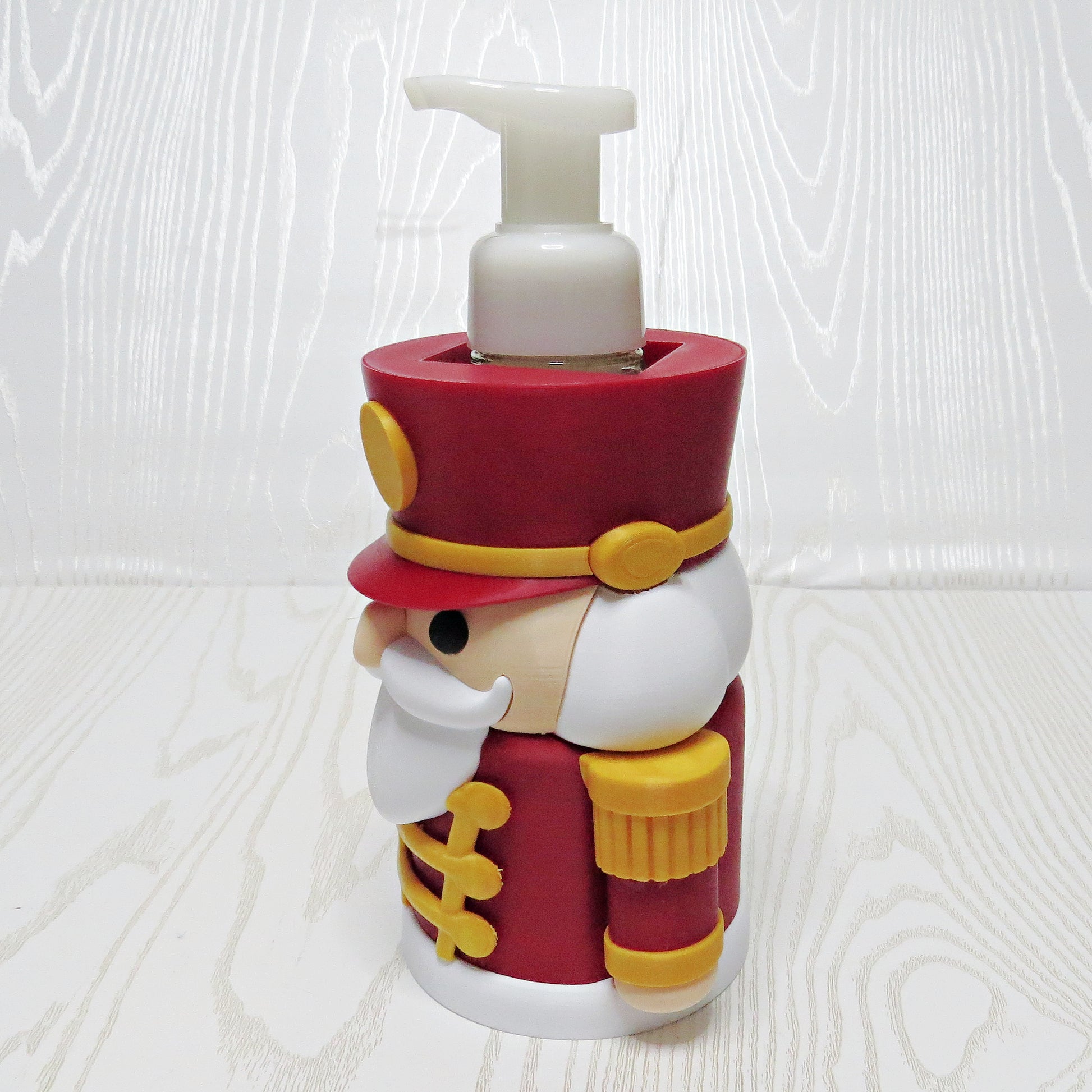 Nutcracker Foaming Soap Holder - Christmas Sink Decor - lifestyle with soap bottle inserted