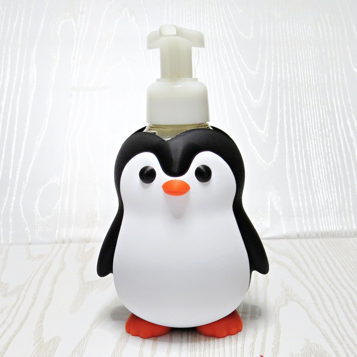 black-white-3d-printed-penguin-foaming-soap-bottle-holder-orange-beak-feet-bathroom-decor