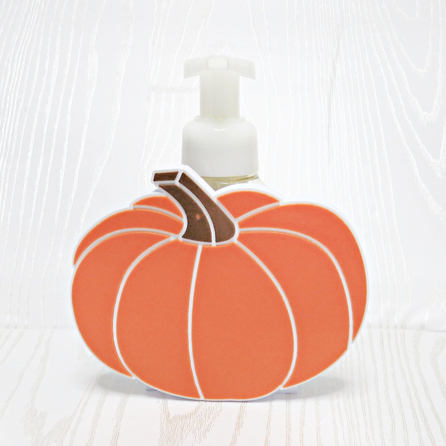 orange-3d-printed-pumpkin-foaming-soap-holder-ribbed-segments-white-outline-brown-stem-fall-halloween-bathroom-decor