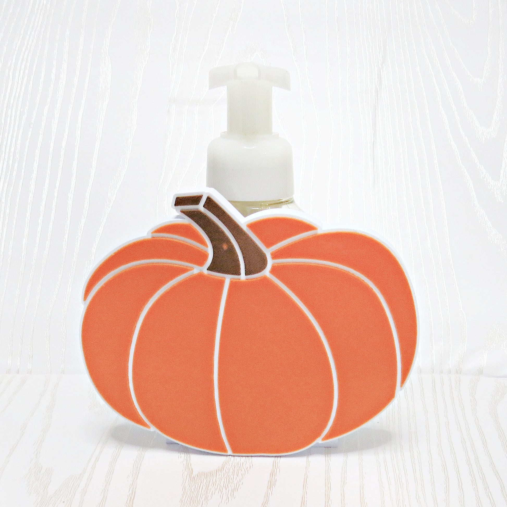 orange-3d-printed-pumpkin-foaming-soap-holder-ribbed-segments-white-outline-brown-stem-fall-halloween-bathroom-decor