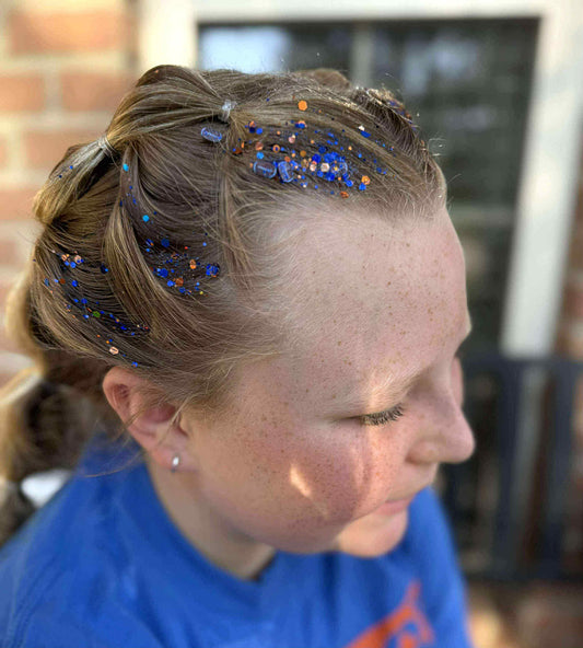 royal-blue-and-orange-glitter-hair-gel-applied-to-braided-hairstyle-for-school-spirit-cheer-game-day-festival-hair-accessory