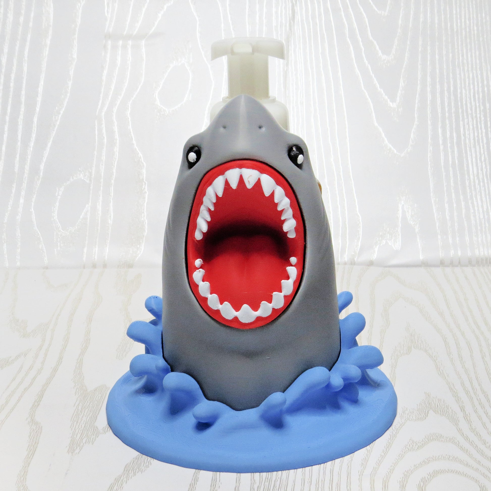 grey-3d-printed-shark-open-mouth-white-teeth-blue-wave-splash-base-foaming-soap-holder-ocean-bathroom-decor