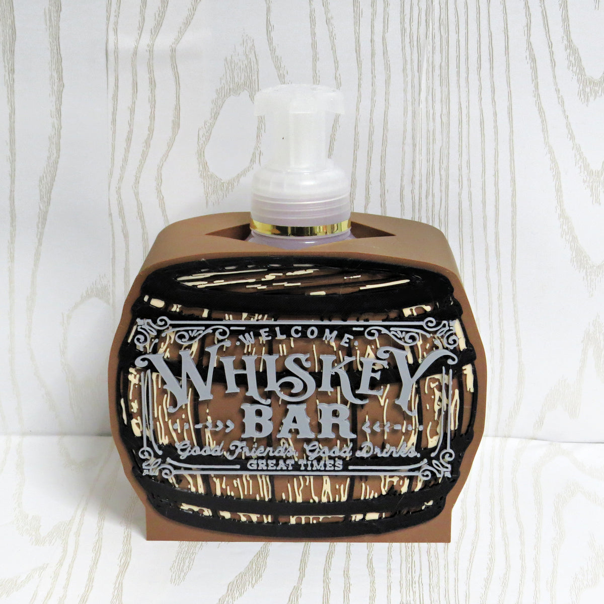 Brown whiskey barrel shaped foaming soap bottle holder with welcome bar sign detail