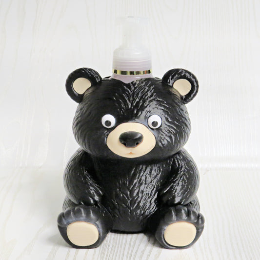 Cute black bear shaped foaming soap bottle holder with googly eyes for bathroom decor