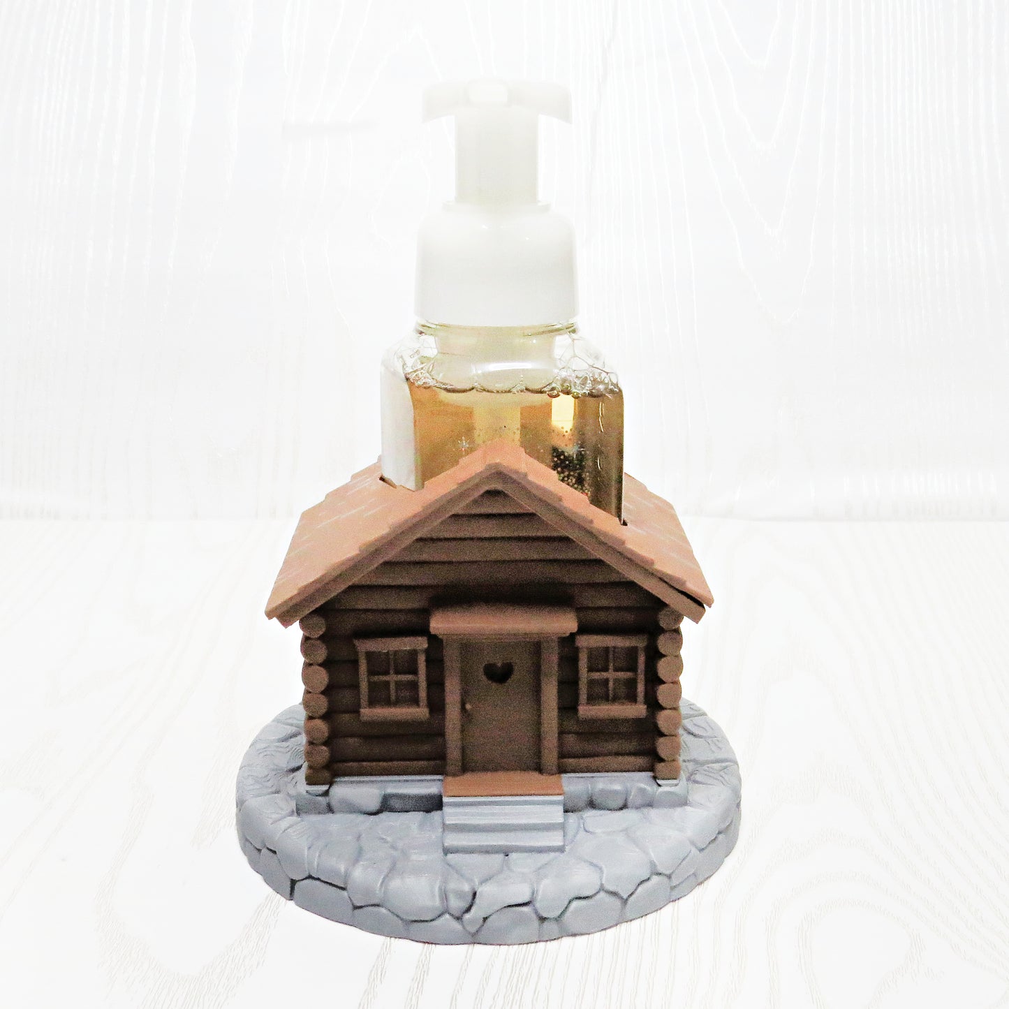 Rustic cabin foaming soap holder on countertop