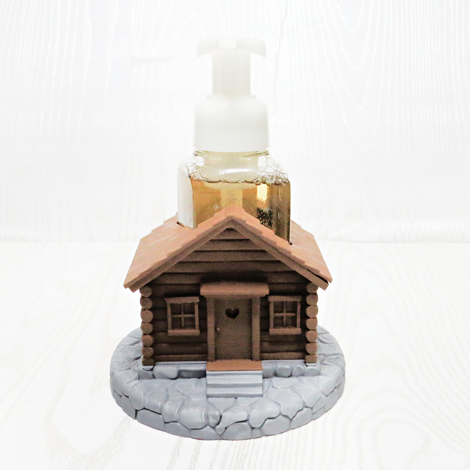 Rustic cabin foaming soap holder on countertop