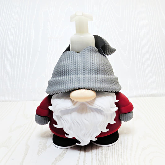 Christmas gnome foaming soap holder with red outfit and gray hat on kitchen counter