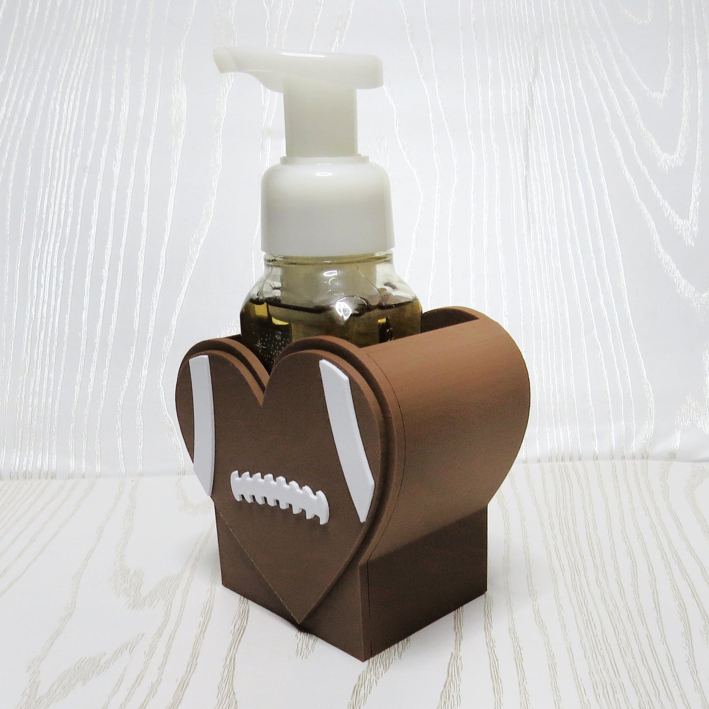 Football Heart Foaming Soap Holder for BBW Foam Soap Bottles - side angle showing product shape