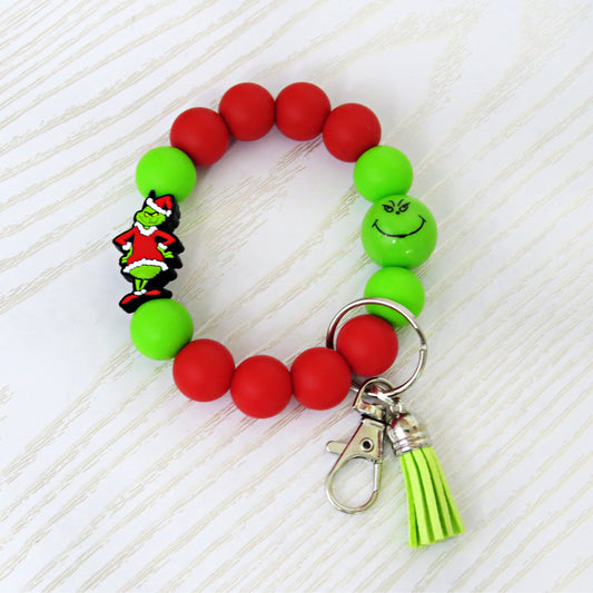 Christmas Beaded Wristlet Keychain – Red & Green Silicone Bracelet with Green Character Charm