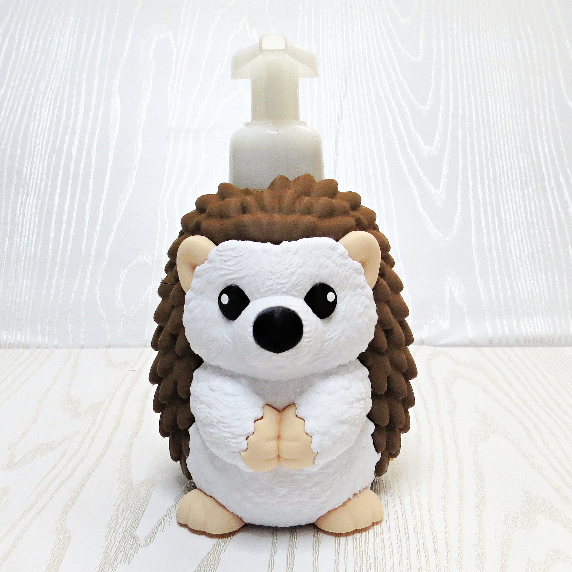 cute hedgehog foaming soap holder on kitchen sink counter
