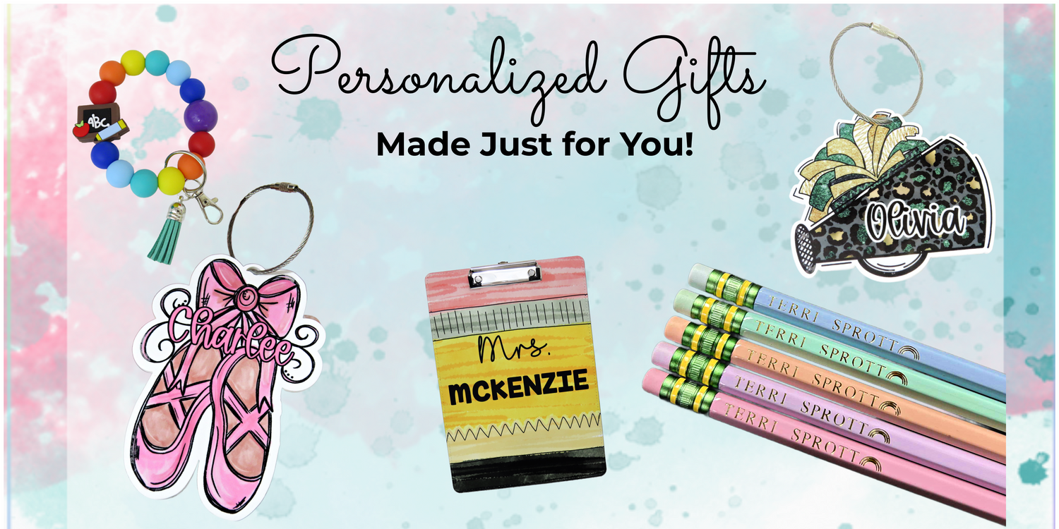 Flatlay of personalized bag tags, pencils, ornaments, and teacher clipboard handmade by Kenzie’s Boutique