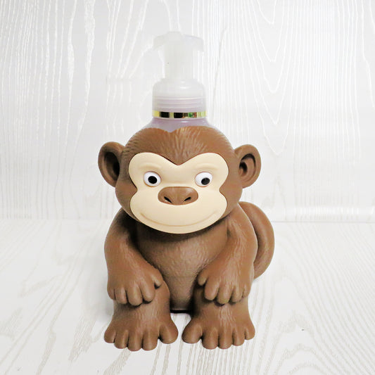 Cute brown monkey shaped foaming soap bottle holder with googly eyes for bathroom decor