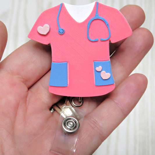 Pink nurse scrub retractable badge reel holder with stethoscope and heart accents for healthcare workers