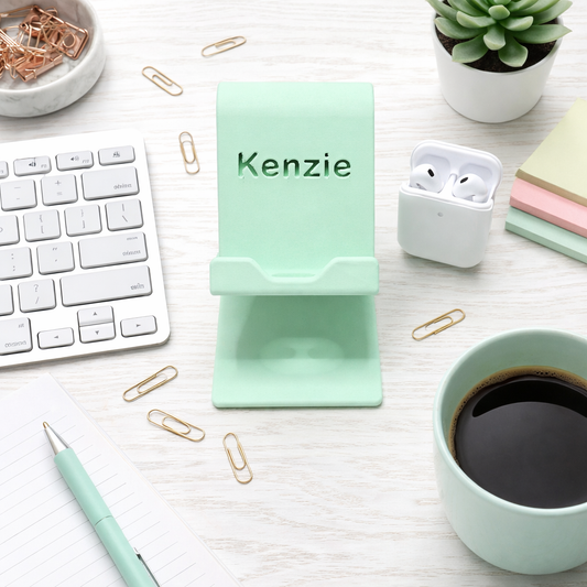 Personalized 3d printed cell phone holder with custom name on desk