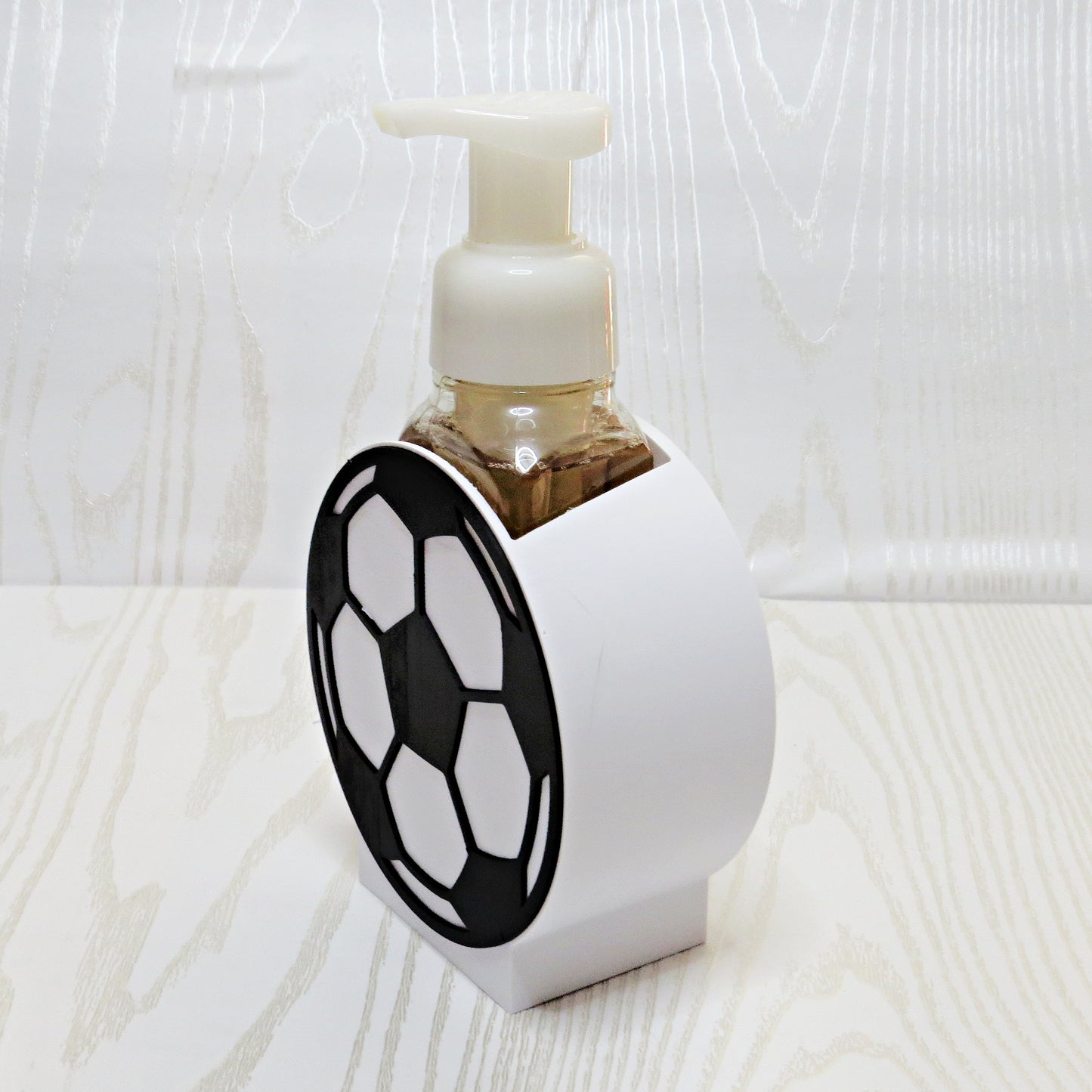 Soccer Ball Foaming Soap Holder - Sports Bathroom Decor for Kids & Soccer Fans - side angle showing product shape
