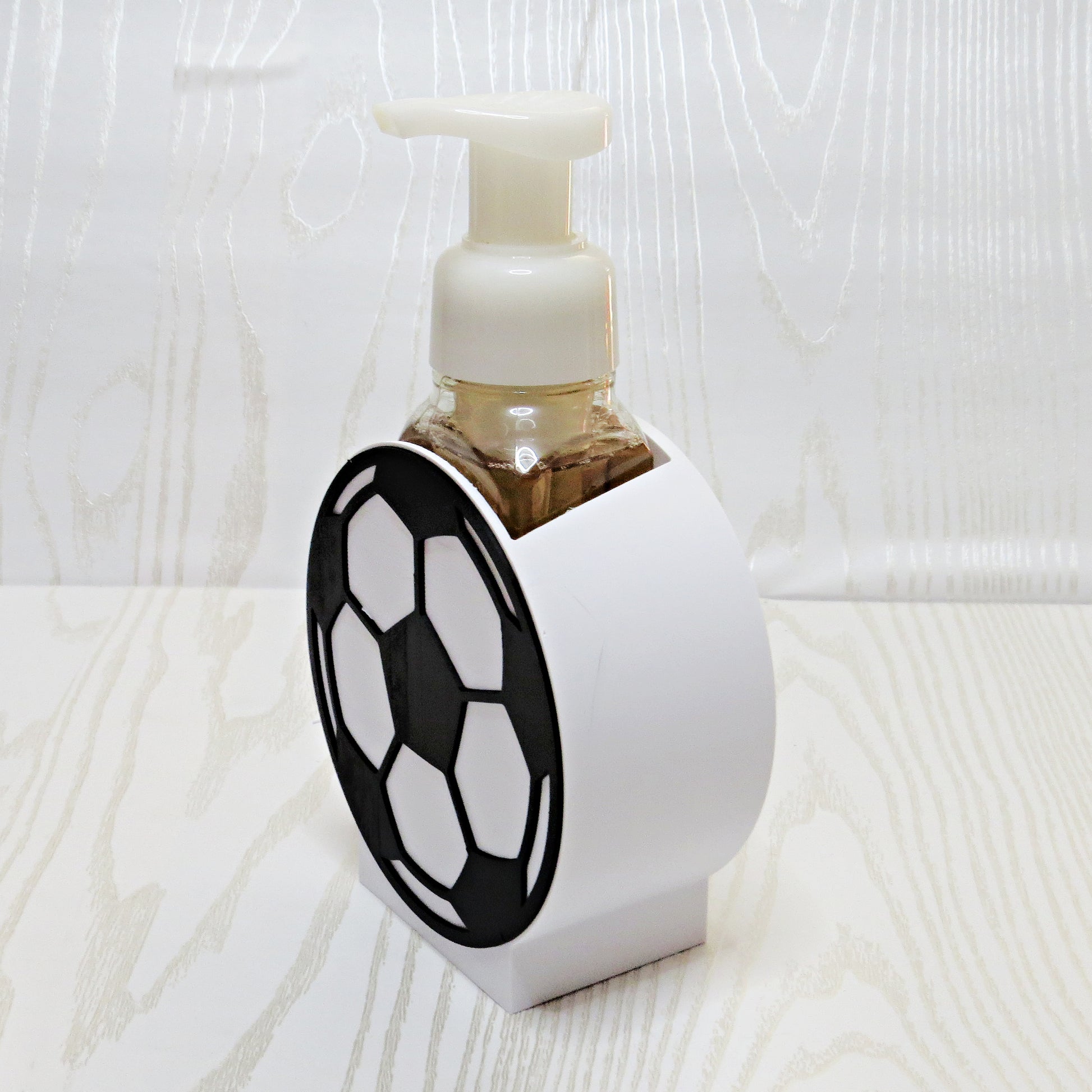 Soccer Ball Foaming Soap Holder - Sports Bathroom Decor for Kids & Soccer Fans - side angle showing product shape
