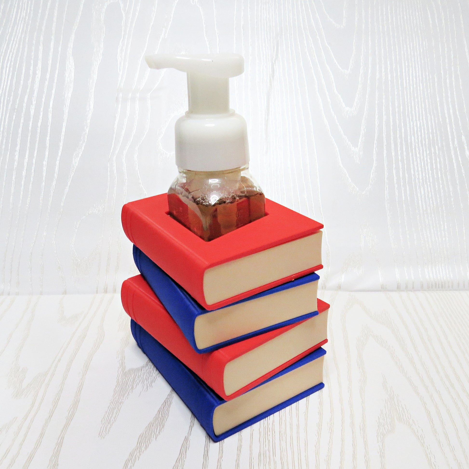 red-blue-3d-printed-stacked-books-foaming-soap-holder-cream-page-edges-teacher-book-lover-bathroom-desk-decor